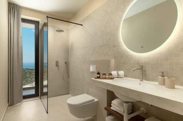 Bathroom with rain shower and sea view