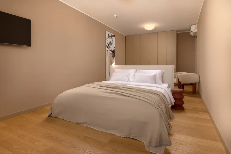 Bedroom two with art and sea view